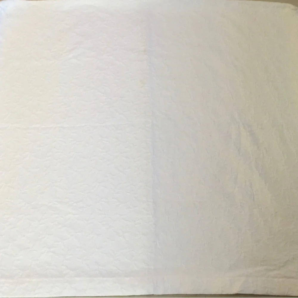 Headboard slipcover. Matelasse fabric in ecru.